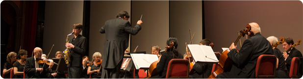 Marcus Sander, winner of the 16-18 age bracket in 2013, plays an alto saxophone solo with the Festival Orchestra.